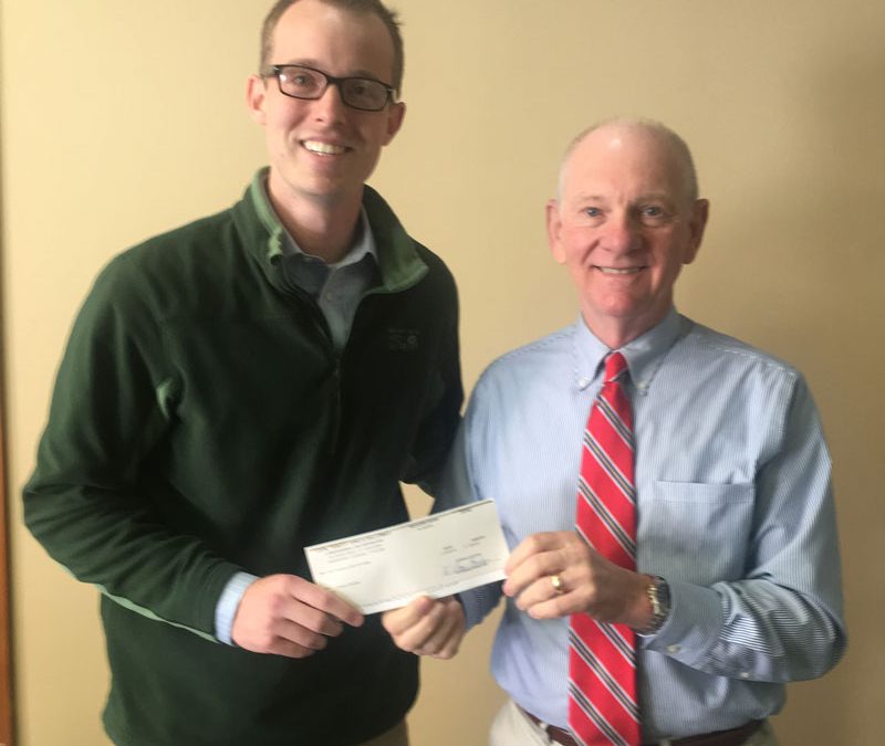 Catholic Charities receives a Christmas donation from Cook Yancey